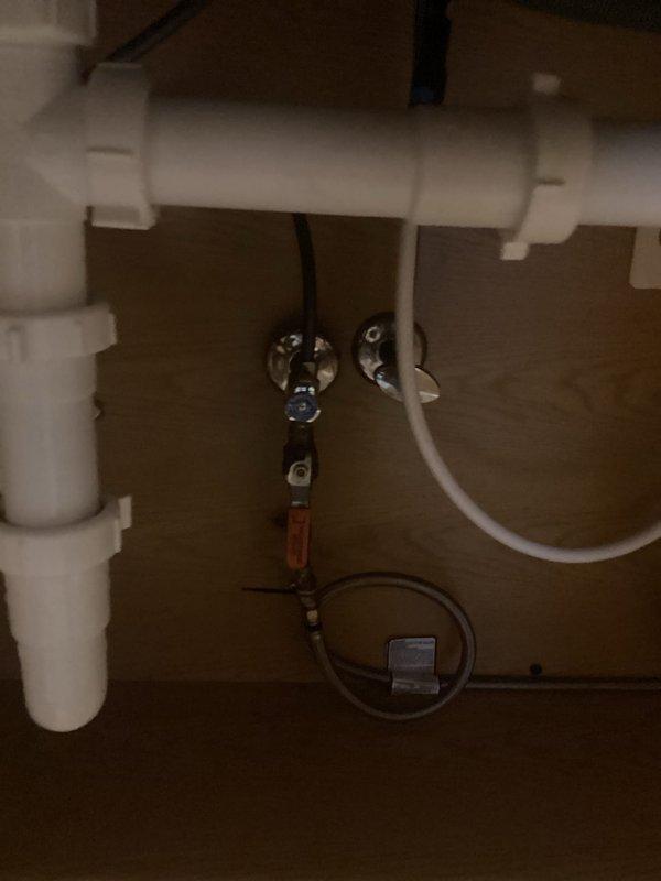 Responded to service call for malfunctioning kitchen sink hose. Upon inspection, assessed the pull-out spray hose assembly and associated connections beneath the double-basin stainless steel sink. Verified proper operation of chrome shut-off valves, supply lines, and spray attachment. Addressed hose functionality issues and ensured secure connections at faucet assembly and under-sink mounting points. Tested system for proper water flow and confirmed leak-free operation of all components upon completion.