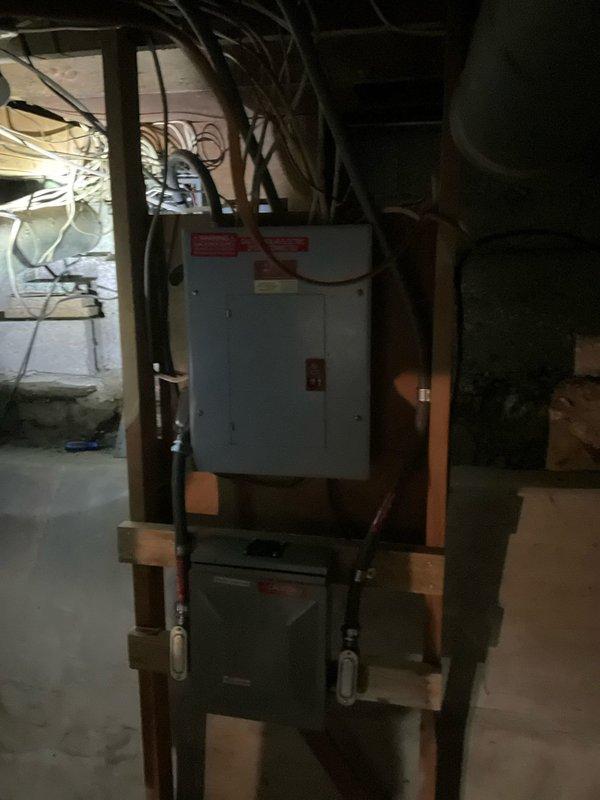 Responded to electrical panel service request at newly purchased residential property. Performed comprehensive inspection of main electrical panel located in basement utility area above HVAC equipment. Panel exhibited warning labels and multiple circuit connections requiring evaluation. Assessed electrical meter installation and exterior service connection point to verify proper utility interface. Documented existing panel configuration, wiring conditions, and compliance considerations for homeowner's reference. Provided recommendations for panel maintenance and potential upgrades to meet current electrical safety standards.