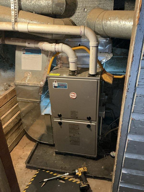 Completed comprehensive rental inspection of residential HVAC system including Payne brand forced-air furnace and associated components. Performed thorough visual assessment and documentation of furnace unit, air handler, ductwork, gas line connections, refrigerant lines, and all mechanical equipment in basement utility area. All components photographed and evaluated for proper installation and current operational condition per rental inspection requirements.