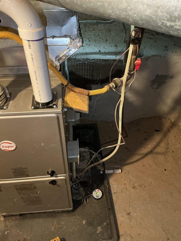 Completed comprehensive rental inspection of residential HVAC system including Payne brand forced-air furnace and associated components. Performed thorough visual assessment and documentation of furnace unit, air handler, ductwork, gas line connections, refrigerant lines, and all mechanical equipment in basement utility area. All components photographed and evaluated for proper installation and current operational condition per rental inspection requirements.