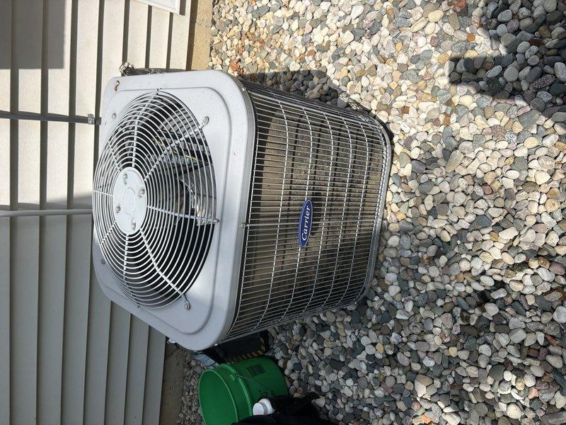 Completed comprehensive ASTU-AC Super Tune-up on outdoor condensing unit and indoor air handler system. Performed thorough inspection of exterior condenser unit positioned on gravel pad, noting unit condition and verifying proper airflow through protective grilles and mesh panels. Conducted detailed assessment of indoor air handler and ductwork system, inspecting insulated plenum, electrical controls, and associated refrigerant lines. Evaluated condenser pad stability and levelness for potential future adjustment to ensure optimal unit performance and longevity.