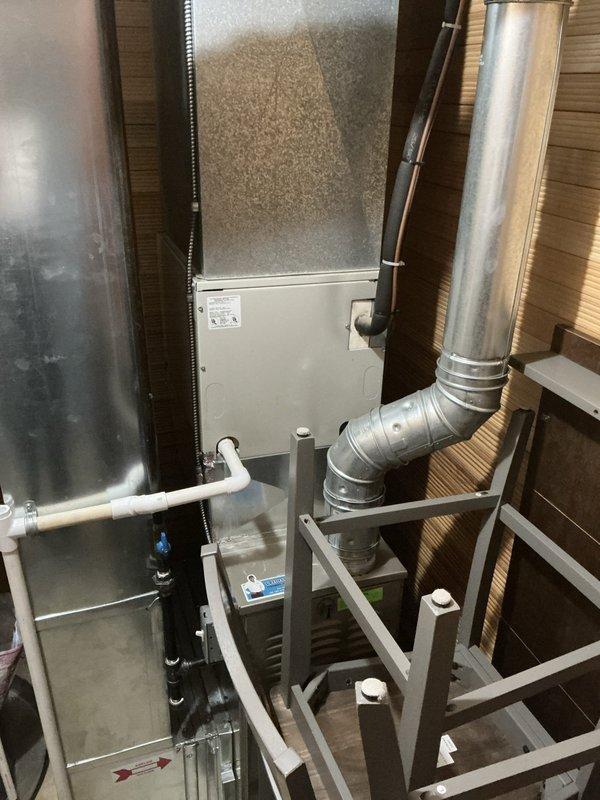 Performed comprehensive evaluation of residential HVAC system experiencing continuous operation. Inspected air handler unit in attic mechanical space, including filter access, ductwork connections, and support framework integrity. Evaluated outdoor condensing unit with protective cage, assessed refrigerant lines, electrical connections, and verified proper drainage. Documented equipment configuration, duct transitions, and overall system condition through photographic evidence to prepare detailed estimate for necessary repairs or system optimization.