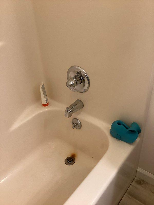 Completed trim kit repair and installation at residential property. Serviced kitchen sink area including faucet assembly with gooseneck spout and soap dispenser, ensuring proper mounting and seal integrity. Addressed bathroom bathtub plumbing fixtures including chrome spout, shower valve with escutcheon plate, and drain assembly to restore proper function and appearance.