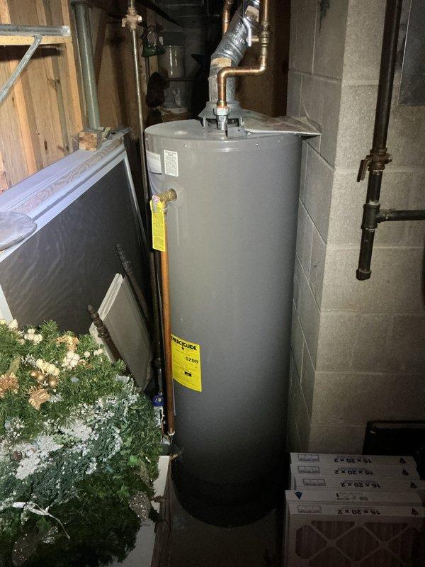 Completed annual cooling maintenance on a 20-year-old Coleman HVAC system. Performed comprehensive inspection of furnace unit, condensate drain lines, electrical connections, and ductwork in basement installation. All components operating within normal parameters at time of service, with PVC drainage system and venting properly configured. Documented equipment condition with photos showing water heater and HVAC installation layout for service records.