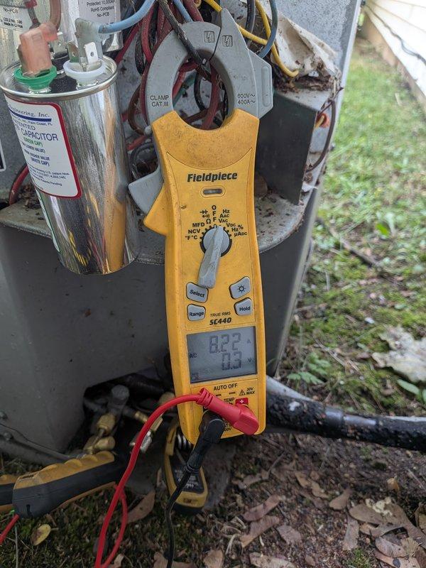 # Cooling System Diagnostic and Capacitor Replacement

Responded to service call for 16-year-old air conditioning system running but not cooling. Upon arrival, performed comprehensive electrical diagnostics on outdoor condensing unit using digital clamp meter to measure voltage, amperage, and capacitance values. Testing revealed failed dual run capacitor with readings significantly below manufacturer specifications. Replaced defective capacitor with properly rated OEM equivalent component, ensuring correct wire terminations to compressor and condenser fan motor circuits. Verified system operation with all electrical parameters within normal operating range. Unit now cooling properly with compressor and fan motor operating at correct amperage draw.