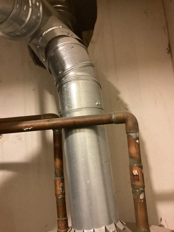 Responded to emergency call for water heater leaking from bottom of unit. Upon arrival, confirmed active leak from 19-year-old Goodman residential water heater. Inspected unit and determined tank failure due to age and internal corrosion. Documented existing installation with copper piping connections and venting configuration. Advised customer that water heater has exceeded typical service life and requires replacement due to compromised tank integrity.