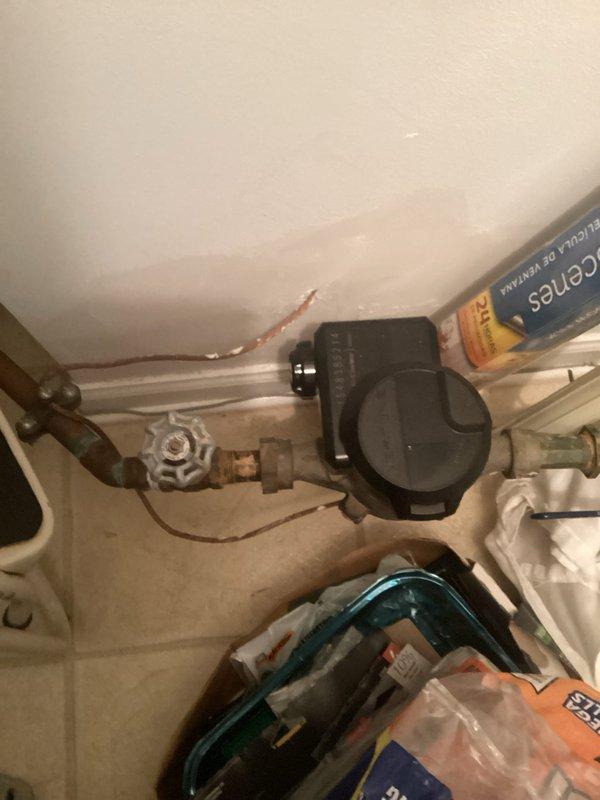 Responded to bathtub leak in 23-year-old home affecting the tub and shower area. Inspected brass-finished single-handle shower control valve, combination tub spout with diverter, and associated plumbing connections in alcove-style bathtub installation. Accessed plumbing infrastructure beneath fixture area, examining copper supply lines, shutoff valves, and connections showing age-related corrosion and discoloration. Replaced faulty fixtures and components, addressed leak source, tested system operation to verify proper water flow and shutoff functionality, and documented repairs with photos for service records.