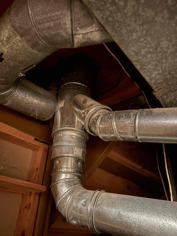 Responded to emergency call for water heater leaking in basement of 50-year-old residential property. Upon arrival, inspected Bradford White Defender Safety System water heater unit dated 2-22-10. Conducted thorough visual assessment of tank, connections, and surrounding plumbing infrastructure including copper supply lines and galvanized vent piping. Documented condition of unit and all associated components with photographic evidence. Evaluated integrity of flue assembly, water connections, and potential leak sources on aging tank system. Provided customer with findings and recommended course of action for resolution.