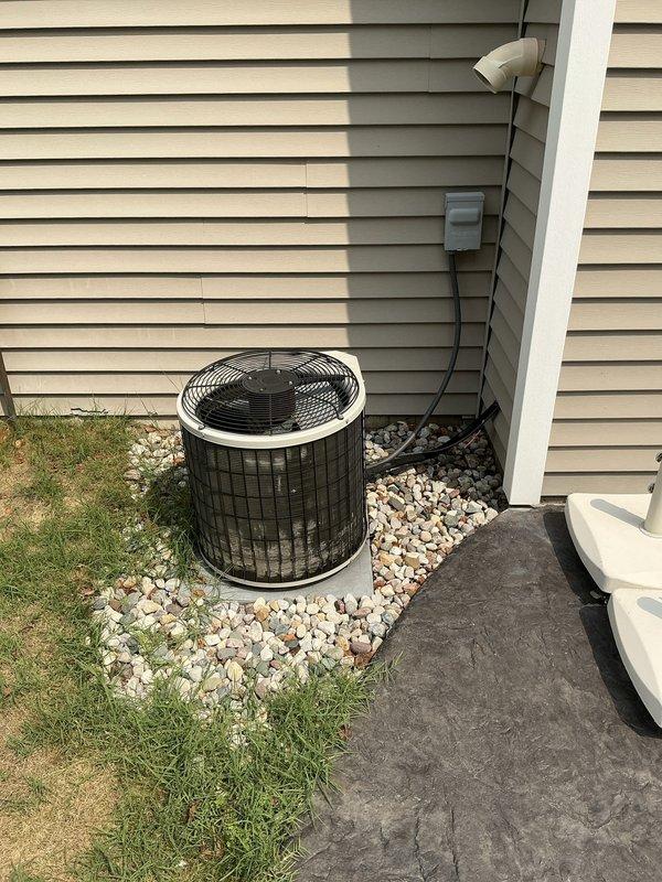 Responded to service call for residential HVAC system with no airflow and complete loss of cooling capacity. Upon arrival, inspected existing Bryant furnace and outdoor condenser unit, both approximately 20 years old and original to the home. Documented current system configuration including basement-installed gas furnace with associated ductwork, PVC venting, and exterior condensing unit positioned on rock bed against building exterior. Photographed both indoor and outdoor equipment to assess overall system condition and installation layout. Provided comprehensive estimate for complete HVAC system replacement including new furnace and air conditioning equipment to address whole-house comfort needs, as previous contractor had recommended full system replacement due to age and operational failure.