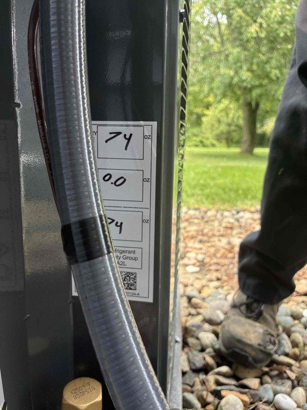 Completed full air conditioning system replacement at residential property. Installed new outdoor condensing unit on existing concrete pad with proper river rock base for drainage and equipment protection. Connected refrigerant lines with appropriate insulation, installed electrical disconnect box, verified system pressures and temperatures showing proper operation at 74°F, and confirmed all components functioning within manufacturer specifications.