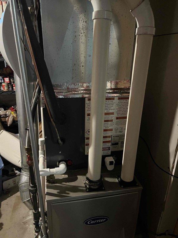 Completed full HVAC system replacement including outdoor condensing unit and indoor furnace. Installed new American Standard outdoor unit on existing concrete pad with proper electrical connections and conduit routing. Replaced indoor air handler with Carrier furnace system, including new PVC intake and exhaust venting through existing penetrations. Verified all refrigerant lines, electrical connections, condensate drainage, and ductwork transitions. System tested and operational upon completion.