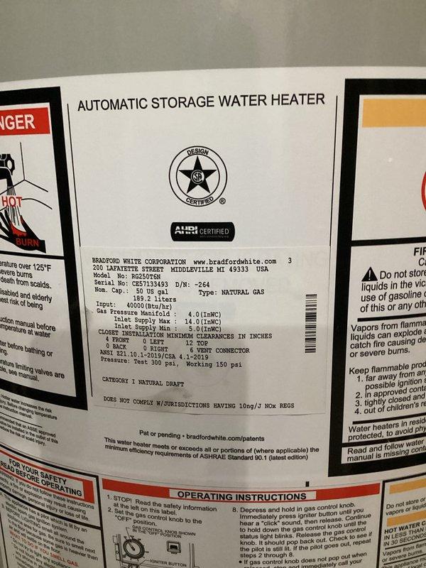Completed installation of a Bradford White 50-gallon natural gas atmospheric vent water heater in residential basement utility area. Unit was positioned on concrete floor with proper clearances, connected copper water supply lines to hot and cold ports, and installed galvanized metal B-vent exhaust system with appropriate pitch and termination. All gas connections were made per manufacturer specifications at 4.0" W.C. manifold pressure, pressure tested for leaks, and verified proper combustion and venting operation upon startup.