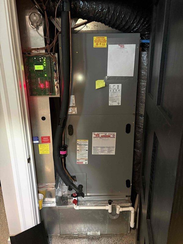 Responded to a no-cooling call on a seven-year-old Fujitsu air conditioning system. Upon arrival, performed comprehensive diagnostic evaluation of the air handler unit and associated components including electrical controls, condensate drainage system, and ductwork connections. Inspected condensate drain line for blockages, noting discoloration and residue buildup within the PVC piping that required attention. Evaluated air handler operation, control board functionality with digital display and indicator lights, and verified proper electrical connections throughout the system. Addressed drainage issues to prevent potential water damage and restore proper system operation. System restored to full operational status with all components functioning as designed.