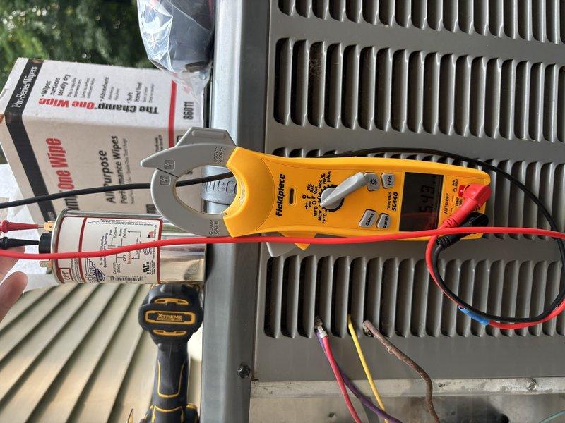 Responded to service call for air conditioning system intermittently tripping circuit breaker after running for extended periods. Performed electrical diagnostics at breaker panel and outdoor condensing unit using clamp meter to measure amperage draw and identify overcurrent condition. Tested system operation, monitored electrical loads, and verified proper circuit protection sizing. Identified faulty component causing excessive current draw on 5-year-old EnergiAir system model WT 05-2031. Replaced defective part to restore normal amperage within specifications and prevent nuisance tripping. Cycled system through multiple operating cycles to confirm stable operation without breaker trips. Unit operating properly at time of departure.