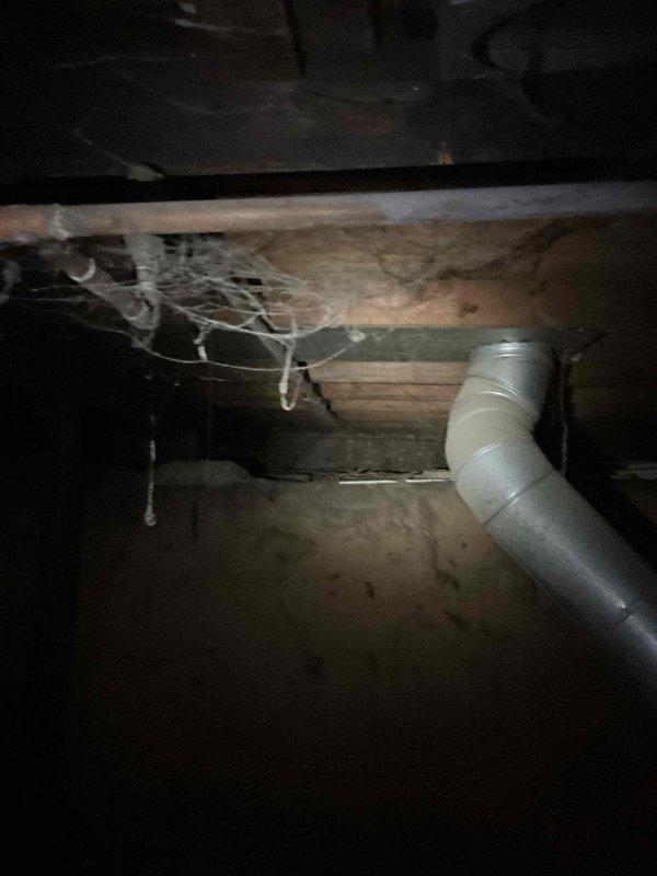 Responded to drain problem and performed inspection of crawl space plumbing system. Documented existing conditions including multiple PVC drain lines, pump assembly with housing, and concrete floor showing moisture staining and deterioration. Determined that hydrojetting service is required to properly address the drainage issue. Photographed crawl space access area showing structural components, HVAC ductwork, and plumbing configuration for follow-up service scheduling.