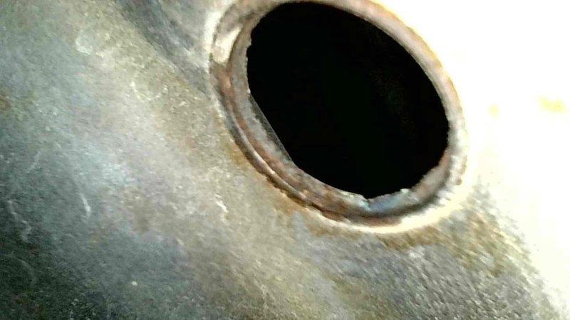 Returned to site to remove and replace hot water heater per previously quoted repair. Upon arrival, inspected tank connections and surrounding area. Documented significant sediment accumulation at base of flue pipe opening and rust staining around combustion chamber access port, indicating advanced age and deterioration of unit. Successfully disconnected water supply lines, gas line, and venting components. Removed failed water heater from premises. Installation area cleaned and prepared for replacement unit. All work completed according to quoted specifications.