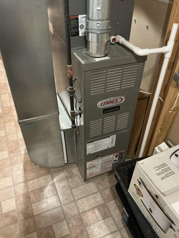 Conducted comprehensive sales estimate for complete HVAC system replacement at residential property. Evaluated existing Lennox furnace installation in utility room, assessed current ductwork configuration including metallic trunk lines and branch connections, and documented equipment specifications and operating conditions. Photographed existing equipment layout, condensate drainage lines, venting systems, and overall mechanical room configuration to provide accurate proposal for new furnace and air conditioning system installation.
