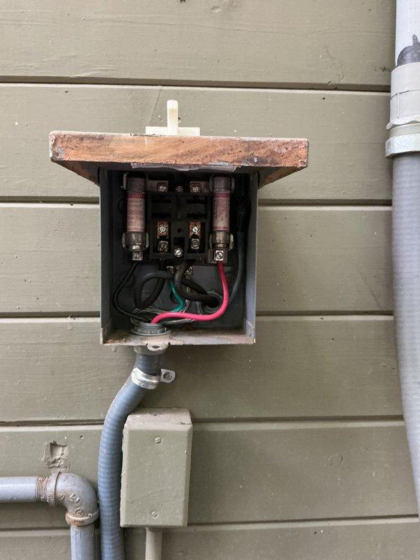 Completed annual cooling maintenance on 4-year-old Rheem AC system. Discovered significant wildlife nesting material (grass, twigs, leaves, and debris) accumulated inside electrical compartment around capacitor, contactors, and wiring. Removed all nesting material to prevent potential fire hazard, electrical shorts, and airflow restrictions. Inspected all electrical connections, capacitor, contactors, and wiring for damage from nest intrusion—all components found to be functional. Checked outdoor disconnect box and fuse holders, which showed age-related weathering but remained operational. System tested and operating properly following debris removal and standard tune-up procedures.