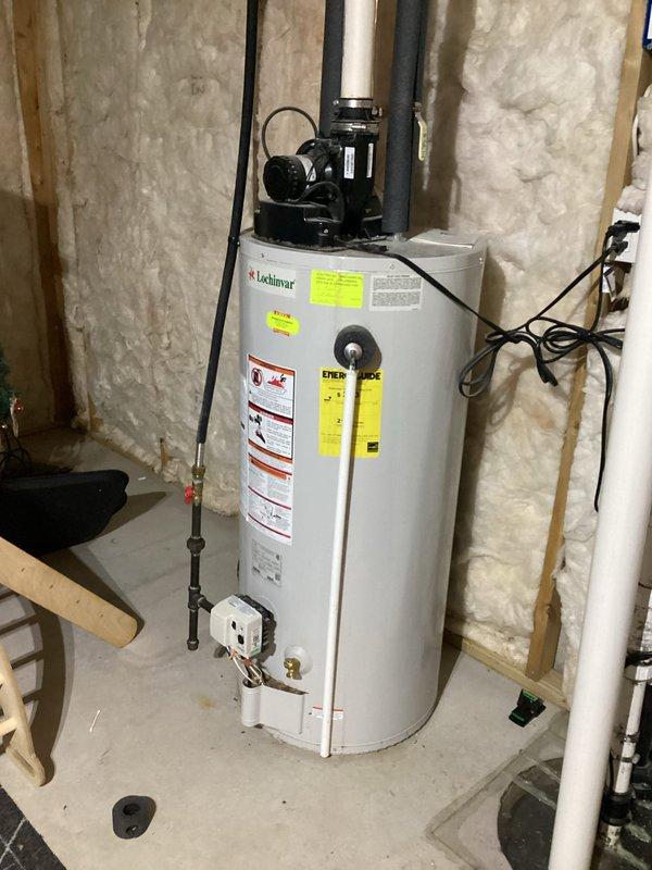 Completed comprehensive water heater tune-up on 15-year-old Lochinvar ENER-LOCK unit. Performed full system flush and tank drainage, which had not been completed in several years, removing accumulated sediment to restore efficiency and extend equipment lifespan. Inspected all connections, pressure relief valve, circulator pump assembly, and verified proper operation of all components.