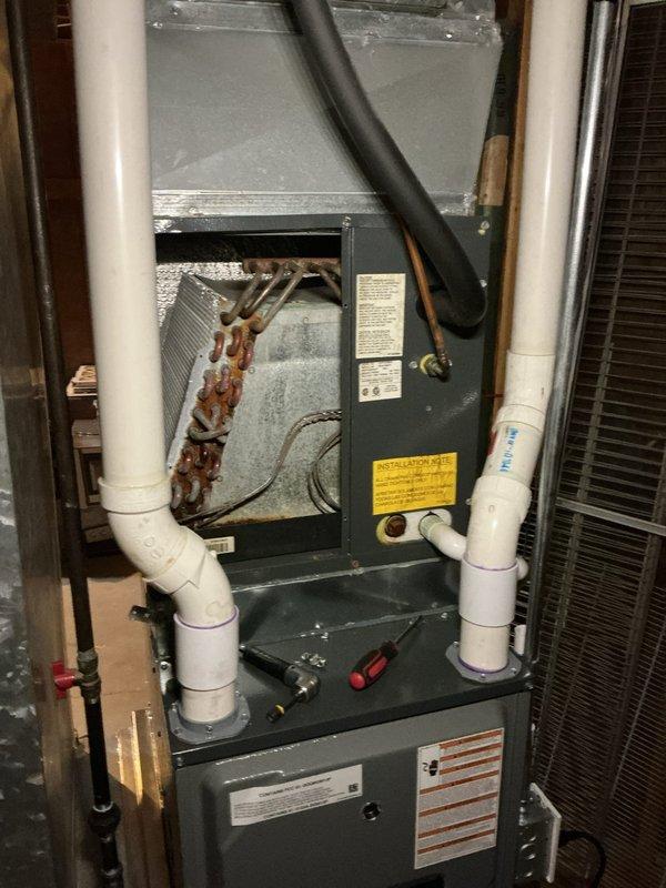 Completed annual cooling maintenance on approximately 20-year-old Amana system. Upon inspection, discovered severely corroded evaporator coil with extensive rust deterioration indicating advanced age-related degradation and possible moisture exposure. Documented system condition with photos showing compromised coil assembly requiring future replacement consideration. Performed standard maintenance procedures on accessible components and advised customer of findings regarding equipment condition and remaining service life expectations.