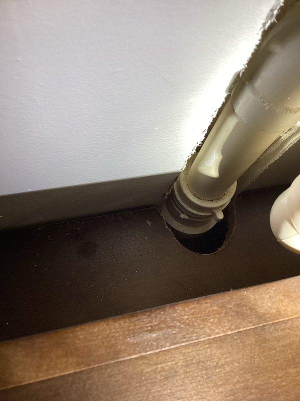 Responded to service call for under sink plumbing inspection and evaluation. Performed thorough assessment of kitchen sink drain system, including P-trap assembly, PVC waste line connections, and basket strainer configuration. Documented existing plumbing conditions with photographs showing vertical drain pipe with rubber coupling connection and complete under-cabinet plumbing layout including flexible braided supply lines. Provided estimate for sewer scoping services and dryer vent replacement as requested.