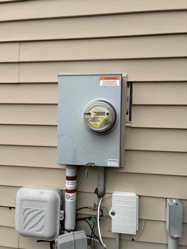 Conducted comprehensive site evaluation for Kohler generator installation at residence equipped with solar panel system. Documented existing electrical service entrance configuration, including meter box, electrical panels, surge protection components, and conduit routing. Assessed current electrical infrastructure capacity and integration requirements for backup generator system. Photographed meter installation, main service panel with interior breaker configuration, and associated electrical components to determine proper sizing and placement specifications. Evaluated solar panel system compatibility and transfer switch requirements for seamless integration with proposed generator. Provided detailed estimate for complete generator installation including necessary electrical modifications and equipment specifications.