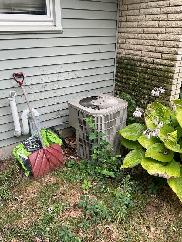 Responded to no-cooling call on 22-year-old residential AC system. Upon arrival, confirmed water accumulation in drain pan and system shutdown as previously advised. Performed comprehensive diagnostic evaluation of both indoor air handler and outdoor condensing unit. Assessed furnace/air handler installation in basement mechanical room, inspecting PVC condensate drain lines, evaporator coil condition, and blower assembly. Evaluated exterior condenser unit for mechanical and electrical functionality, checking refrigerant pressures, compressor operation, and fan motor performance. Documented equipment age and overall system condition through photographic evidence. Provided detailed estimate for necessary repairs to restore cooling operation versus replacement options given the advanced age of the existing HVAC system.