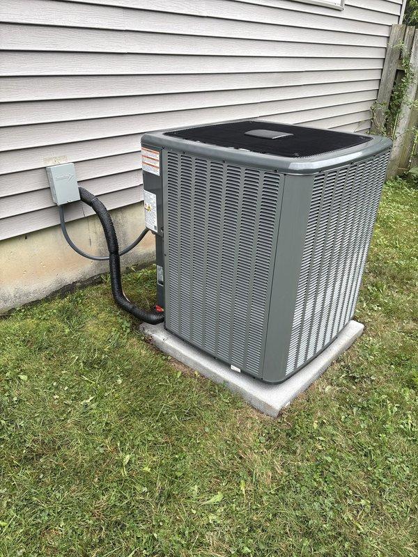 Completed full air conditioning system replacement at residential property. Installed new outdoor condensing unit on existing concrete pad with proper electrical disconnect and conduit connections to exterior wall. Connected indoor air handler to existing furnace system with appropriate ductwork integration including flexible and rigid metal ducting with insulation. Verified all electrical connections, refrigerant lines, and condensate drainage were properly installed and secured. System startup performed with successful operational testing of all components.