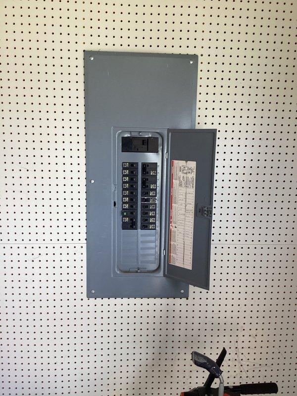 Conducted electrical estimate for residential property requiring two new dedicated outlets. Assessed existing electrical panel capacity and circuit availability for relocated air conditioning unit being installed by HVAC contractor. Evaluated electrical requirements for hot tub installation, including load calculations and appropriate circuit sizing. Inspected main breaker panel to determine available spaces and amperage capacity for additional circuits. Photographed existing electrical panel configuration showing current breaker layout and available positions for new circuit installations. Provided technical assessment for installing properly sized circuits with appropriate overcurrent protection to support both appliances per NEC requirements.