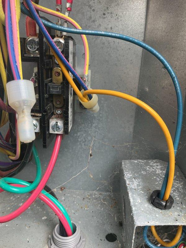 Completed annual cooling system tune-up on 2018 unit under EnergiAir warranty coverage. Performed comprehensive inspection of electrical connections and terminal blocks, documenting wiring configuration and component condition. All electrical terminals were found secure with proper wire connections; system operating within normal parameters with no immediate service needs identified.