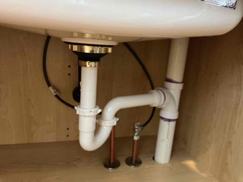 Responded to laundry tub drain stopper issue where the original stopper's finish had worn through and was removed but could not be reinstalled. Sourced and installed a replacement drain stopper assembly compatible with the existing sink configuration. Verified proper operation of the new stopper mechanism and confirmed no leaks present in the drain assembly.