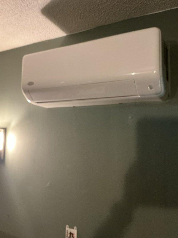 Responded to service call for wall-mounted ductless mini-split system experiencing recurring refrigerant line freezing. Upon arrival, observed ice accumulation on refrigerant lines that would temporarily thaw but quickly re-freeze during operation. Based on system history of similar issues previously resolved by refrigerant recharge, performed diagnostic evaluation of the unit. Checked refrigerant charge levels, identified low refrigerant condition causing inadequate pressure and subsequent line freezing. Recharged system to manufacturer specifications, verified proper operation, and confirmed resolution of freezing issue. Unit returned to normal cooling operation with proper airflow and temperature differential.