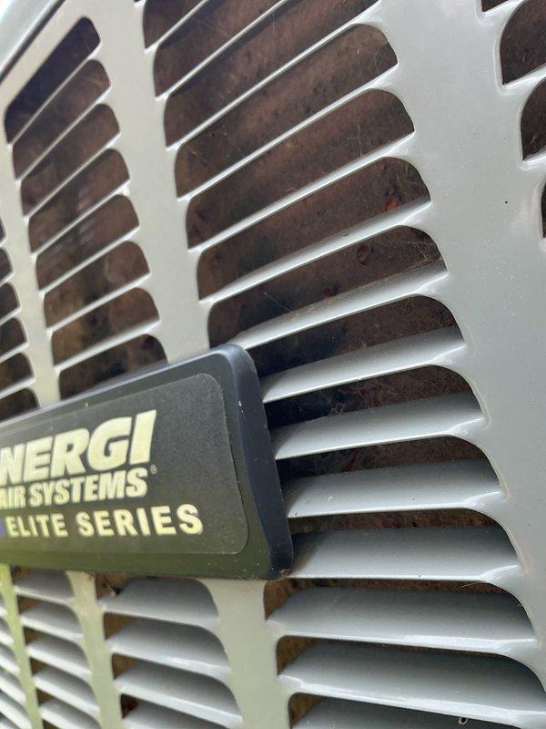 Completed annual cooling maintenance on Energi Air Systems Elite Series HVAC unit. Performed comprehensive system inspection, tested capacitor voltage reading at 235.1V, and evaluated overall unit operation. Observed dirt and debris accumulation on internal components behind ventilation louvers; unit remains operational with all electrical components testing within normal parameters.