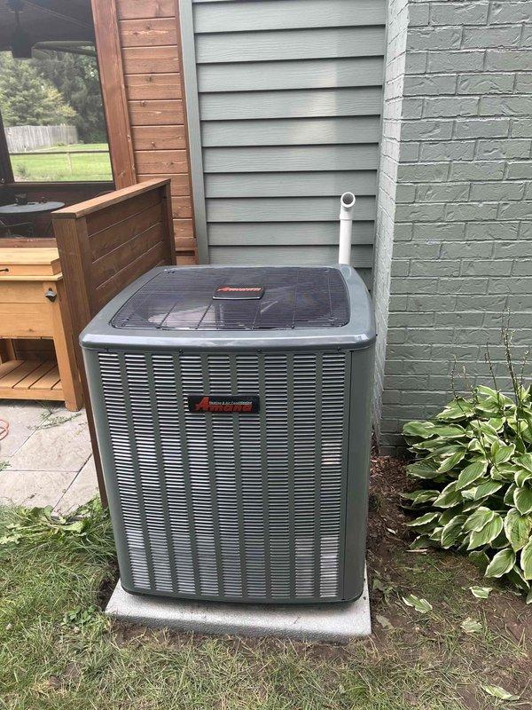 Completed full HVAC system installation including new Amana air conditioning condenser unit and furnace. Exterior condenser positioned on level concrete pad with proper clearances, refrigerant lines and condensate drain installed with vertical PVC piping. Interior furnace installed in basement utility area with insulated ductwork properly supported and secured, all electrical and gas connections completed to manufacturer specifications. System tested and verified operational, all required paperwork processed and finalized.