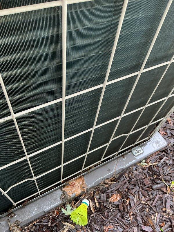 Completed annual cooling system maintenance and inspection on residential outdoor condensing unit. Upon arrival, found significant dirt and debris accumulation on condenser coils and intake surfaces. Performed thorough cleaning of condenser coils, removed organic matter and dust buildup from fins and grille areas. Inspected unit operation, verified proper airflow through heat exchanger, and confirmed system functionality. Unit returned to normal operating condition with improved heat transfer efficiency following coil cleaning and maintenance procedures.