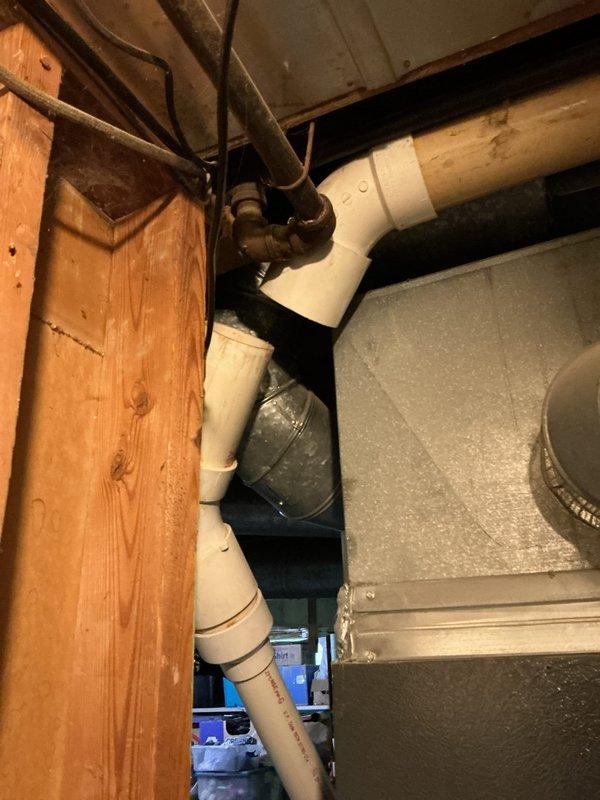 Completed annual AC tune-up and investigated recurring mold growth in humidifier drain tube. Inspected humidifier piping configuration and drainage system, documenting current horizontal drain tube routing that contributes to standing water and mold development. Provided estimate for humidifier removal, Air Ranger purification system installation, and UV light equipment to address air quality concerns and prevent future microbial growth.