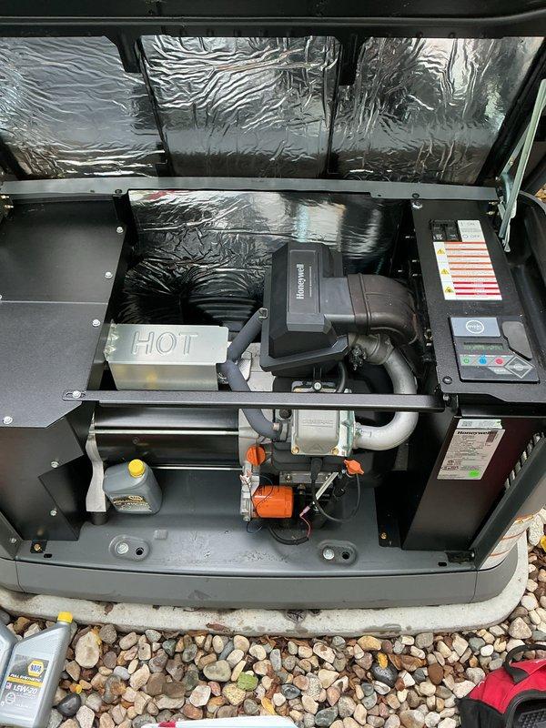 Completed annual generator tune-up and preventative maintenance on Honeywell standby unit. Performed comprehensive system inspection including visual examination of all internal components, electrical connections, control board, and fluid levels. Removed and inspected air filter element, which showed normal wear consistent with one year of operation. Verified proper operation of blower motor assembly, fuel delivery system with visible pump and reservoir, and control panel indicators. Checked all PVC piping connections and mechanical linkages for secure mounting and proper alignment. Documented system condition through photographs showing clean internal compartment, properly functioning components, and acceptable filter condition. Unit operating within normal parameters with no issues identified requiring immediate attention.