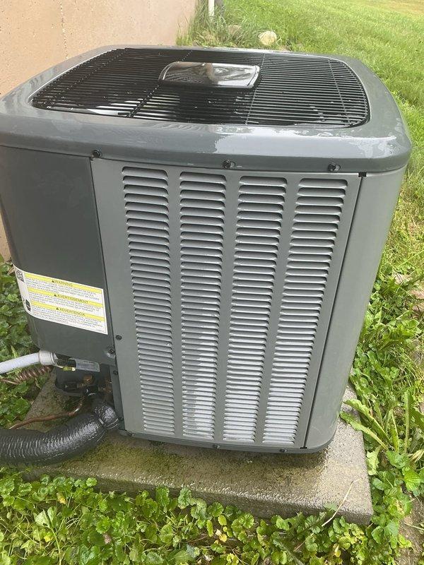 Completed annual cooling maintenance on outdoor condensing unit under 4-year EnergiAir warranty program. Performed comprehensive system inspection, documenting unit condition with exterior showing moderate dirt accumulation on ventilation louvers and minor weathering on cabinet surfaces. Verified proper installation on concrete pad with appropriate clearances, inspected electrical conduit connections, and confirmed all safety labels present and legible. Unit operational and ready for cooling season.