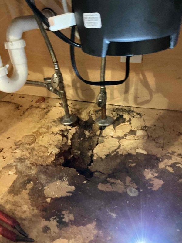 Responded to a kitchen sink faucet leak that had been occurring for approximately five months and significantly worsened over the previous three days. Upon arrival, found the water supply to the sink had been shut off by the homeowner. Inspected the existing 30-year-old faucet assembly and confirmed severe corrosion and deterioration requiring complete replacement rather than repair.

Removed the failed single-handle faucet assembly from the double-basin porcelain kitchen sink. Addressed underlying issues with the mounting hardware and supply line connections that showed age-related wear consistent with the 27-year-old home. Cleaned and prepared the mounting surface on the countertop to ensure proper seating of the new fixture.

Installed a new brushed nickel single-handle kitchen faucet with appropriate supply line connections. Verified proper alignment and secure mounting to prevent future leaks. Restored water supply to the sink and conducted thorough testing of the new faucet assem