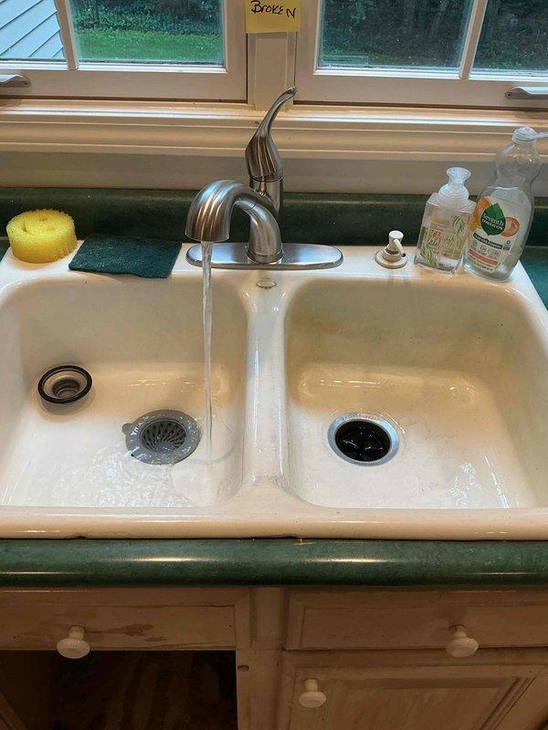 Responded to a kitchen sink faucet leak that had been occurring for approximately five months and significantly worsened over the previous three days. Upon arrival, found the water supply to the sink had been shut off by the homeowner. Inspected the existing 30-year-old faucet assembly and confirmed severe corrosion and deterioration requiring complete replacement rather than repair.

Removed the failed single-handle faucet assembly from the double-basin porcelain kitchen sink. Addressed underlying issues with the mounting hardware and supply line connections that showed age-related wear consistent with the 27-year-old home. Cleaned and prepared the mounting surface on the countertop to ensure proper seating of the new fixture.

Installed a new brushed nickel single-handle kitchen faucet with appropriate supply line connections. Verified proper alignment and secure mounting to prevent future leaks. Restored water supply to the sink and conducted thorough testing of the new faucet assem