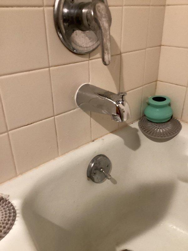 Provided estimate for installation of new kitchen sink with garbage disposal unit and replacement of bathroom shower faucet. Assessed existing bathroom plumbing fixtures including chrome tub spout, shower diverter valve, and drain assembly in tiled enclosure. Evaluated bathroom sink with brushed nickel centerset faucet for reference to existing plumbing configuration. Customer to determine disposal unit selection prior to installation scheduling.