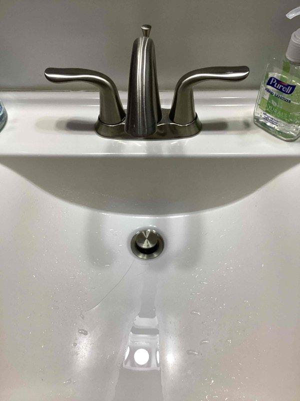 Provided estimate for installation of new kitchen sink with garbage disposal unit and replacement of bathroom shower faucet. Assessed existing bathroom plumbing fixtures including chrome tub spout, shower diverter valve, and drain assembly in tiled enclosure. Evaluated bathroom sink with brushed nickel centerset faucet for reference to existing plumbing configuration. Customer to determine disposal unit selection prior to installation scheduling.