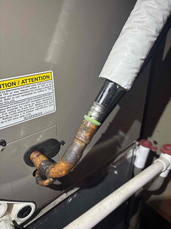 Completed annual cooling maintenance on 5-year-old York AC system. Performed comprehensive tune-up including inspection of outdoor condenser unit, refrigerant lines, and indoor components. Documented significant rust and corrosion present on copper refrigerant piping connections, which will require monitoring for potential future leak development. Verified electrical connections, tested system operation, and confirmed proper drainage function. Unit operational at time of service completion.