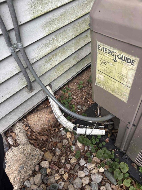 Completed annual cooling maintenance on 5-year-old York AC system. Performed comprehensive tune-up including inspection of outdoor condenser unit, refrigerant lines, and indoor components. Documented significant rust and corrosion present on copper refrigerant piping connections, which will require monitoring for potential future leak development. Verified electrical connections, tested system operation, and confirmed proper drainage function. Unit operational at time of service completion.