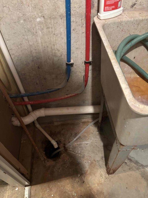 Completed installation of new water softener system with electronic control head and brine tank in utility area. Replaced existing 50-gallon electric water heater with new unit, connecting all supply and drain lines. Installed 1.6 gallon per flush tall round toilet in downstairs bathroom at no additional charge. Investigated persistent drain issue as requested by client; drain remains non-functional and will require further assessment to identify underlying blockage or system defect. All new plumbing equipment tested and operational except for the problematic drain line. Job duration was 4 hours.