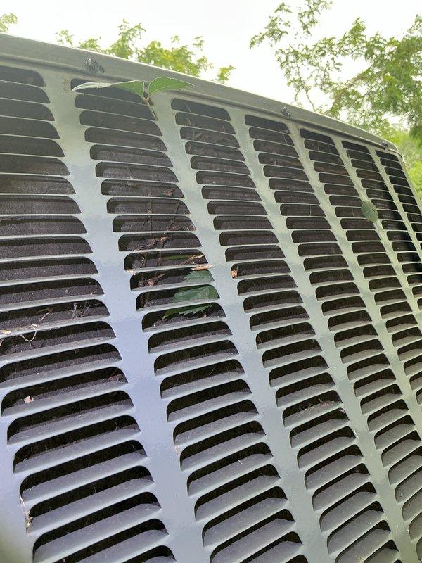 Completed annual cooling system maintenance and inspection on outdoor HVAC unit. Performed comprehensive tune-up including cleaning of condenser coils and louver panels, removing accumulated debris such as leaves and organic material from grille openings and exterior surfaces. Inspected condenser fins, verified proper airflow through ventilation slats, and assessed overall unit condition. Equipment operating within normal parameters following service. Customer requested scheduling of furnace tune-up to be completed at earliest available appointment.