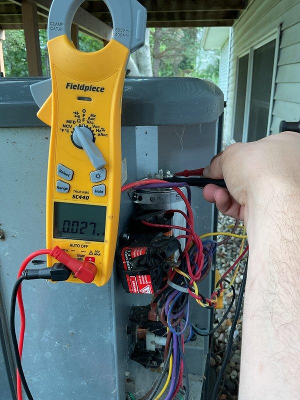 Completed annual cooling maintenance on 2019 Goodman AC system. Performed electrical diagnostics using clamp meter, measuring capacitor microfarad ratings and verifying proper voltage at contactor. Inspected all electrical connections, tested capacitor functionality, and evaluated compressor amperage draw. All components operating within manufacturer specifications; system ready for cooling season.