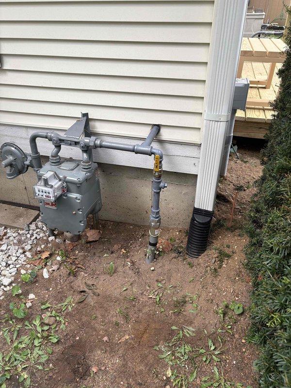 Responded to inspection correction notice requiring protective coating on exposed gas piping outside building envelope. Applied corrosion-resistant paint to all exposed black iron pipe sections on exterior installations, including gas meter connections and standby generator supply lines, to comply with MRC G2414.8, IFGC 403.8, MRC G2415.11, IFGC 404.11, MRC G2415.11.2, and IFGC 404.11.2 requirements for pipes in corroding conditions.