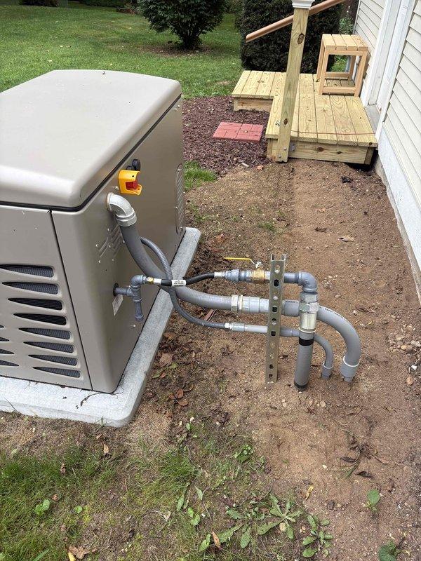 Responded to inspection correction notice requiring protective coating on exposed gas piping outside building envelope. Applied corrosion-resistant paint to all exposed black iron pipe sections on exterior installations, including gas meter connections and standby generator supply lines, to comply with MRC G2414.8, IFGC 403.8, MRC G2415.11, IFGC 404.11, MRC G2415.11.2, and IFGC 404.11.2 requirements for pipes in corroding conditions.