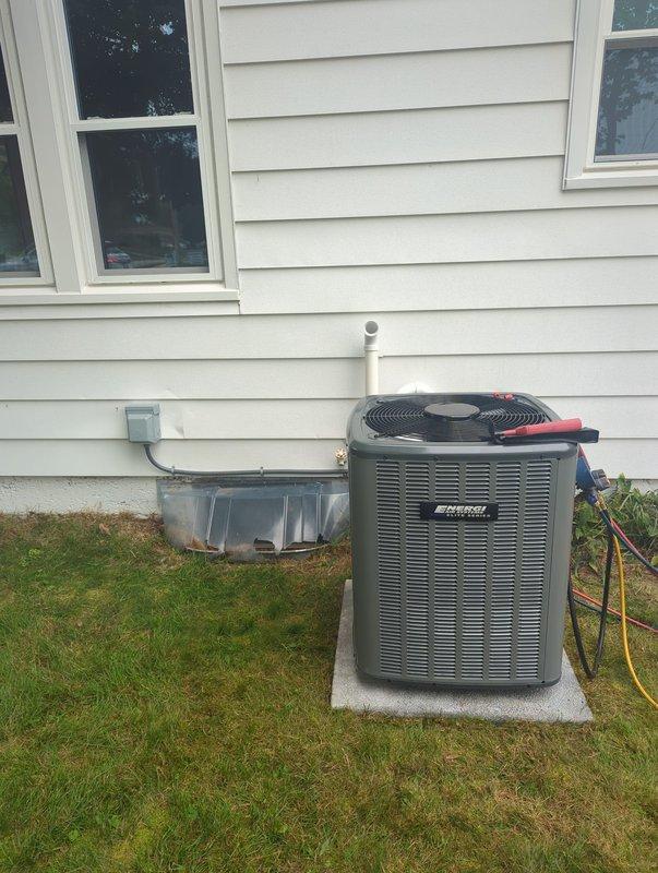 Successfully completed add-on air conditioning system installation to existing forced-air heating system. Installed new outdoor condensing unit on concrete pad with proper clearances from structure and window well. Unit positioned on side of residence with appropriate electrical disconnect and refrigerant line connections. Connected AC system to existing furnace infrastructure in basement mechanical room, integrating with current ductwork distribution system. Ran refrigerant lines from outdoor condenser to indoor evaporator coil, properly insulated and secured. Installed condensate drain piping using PVC, routed to appropriate drainage location. Charged system with refrigerant to manufacturer specifications using manifold gauges. Verified proper airflow, superheat, and subcooling values. Tested system operation through complete cooling cycle, confirming proper compressor function, fan operation, and temperature differential across evaporator coil. All installation work completed per ma